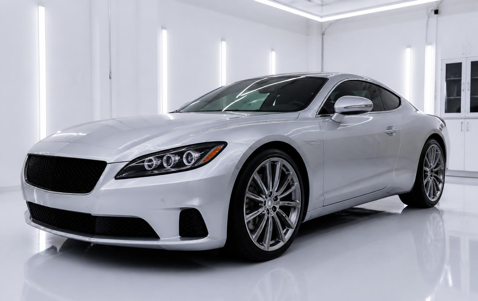 Freshly ceramic coated silver coupe reflecting studio lighting